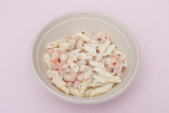 Creamy Shrimp Penne Pasta in White Sauce Served in Bowl, Top View