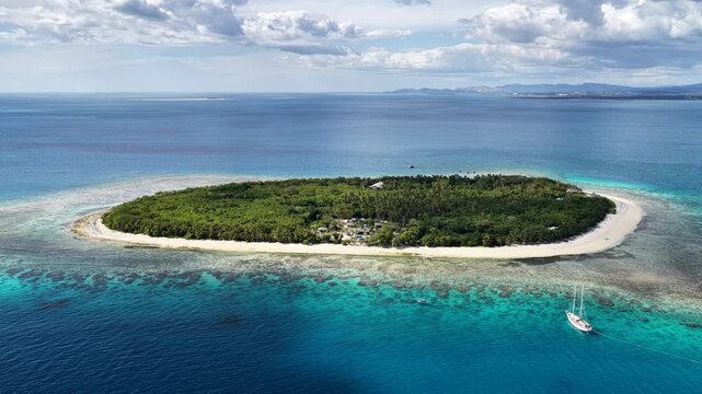 Aerial view of a coral reef and deep blue sea, Serenity Island, Fiji