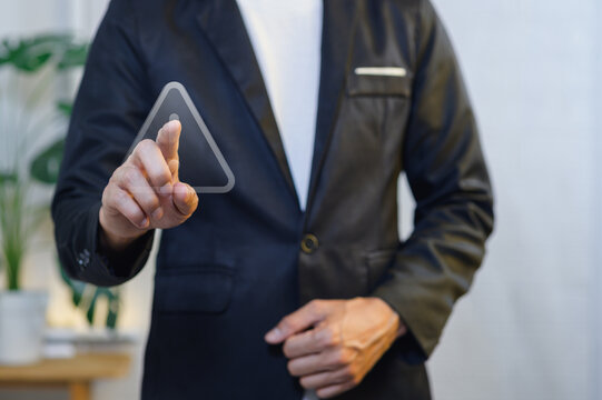 Business Professional Interacting with Transparent Digital Touch Interface in Office