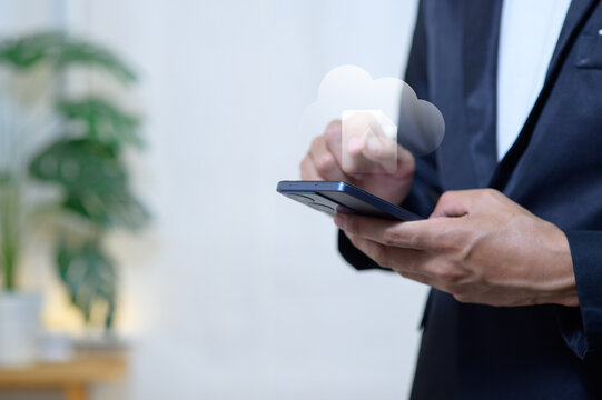 Professional Businessman Using Smartphone with Cloud Technology in Office Setting