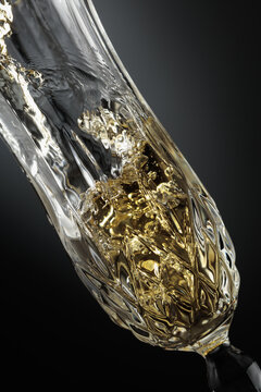 White sparkling wine is poured into a glass.