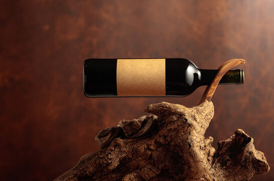 Bottle of red wine with empty paper label.