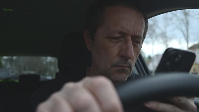 Car driver reacting to upsetting text message on phone, reading bad news on smartphone, worried expression and raised eyebrow in tense moment, concerned look and emotional stress inside vehicle, 4K