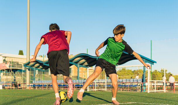 Young soccer players practicing drill on outdoor field