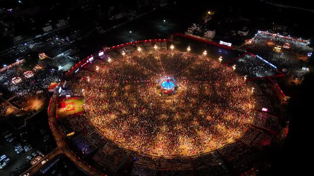Scenic Aerial View of United Way of Baroda Grand Garba Celebration, World's Largest Garba Festival, Thousands of Dancers in Traditional Attire, Vibrant Navratri Celebration, Colorful Cultural Event an