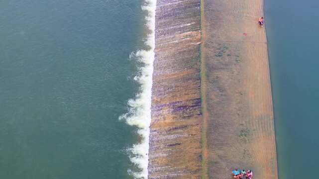 Scenic Aerial View of Check Dam on a River with Flowing Water, Lush Green Surroundings, Calm Reservoir, Rural Landscape, Water Conservation Structure and Beautiful Natural Scenery