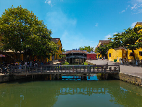 Aerial view of Chua Cau or Japanese Covered ancient Bridge and River in Old city of Hoi An, Vietnam. One of the most travel popular touristic destinations, UNESCO world heritage 
