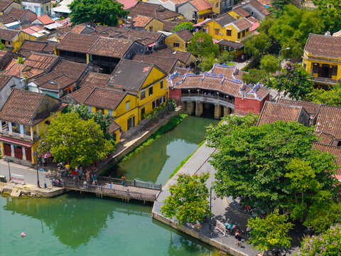 Aerial view of Chua Cau or Japanese Covered ancient Bridge and River in Old city of Hoi An, Vietnam. One of the most travel popular touristic destinations, UNESCO world heritage 