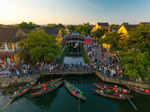 Aerial view of Chua Cau or Japanese Covered ancient Bridge and River in Old city of Hoi An, Vietnam. One of the most travel popular touristic destinations, UNESCO world heritage 