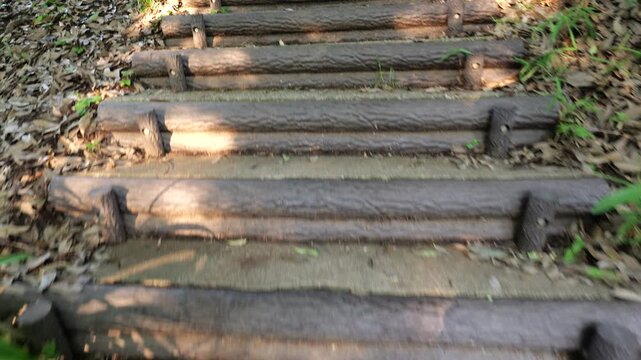 First-person view of walking up outdoor stone steps. Smooth forward camera movement, immersive POV perspective, natural environment, ideal for travel, hiking, adventure, and nature themes.