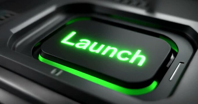 Finger pressing glowing green launch button on dark electronic device close up.