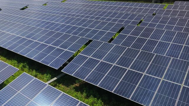 High angle drone view of modern solar farm panels