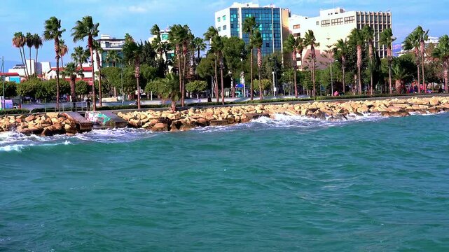Aerial video at Limassol promenade on a sunny windy winter day