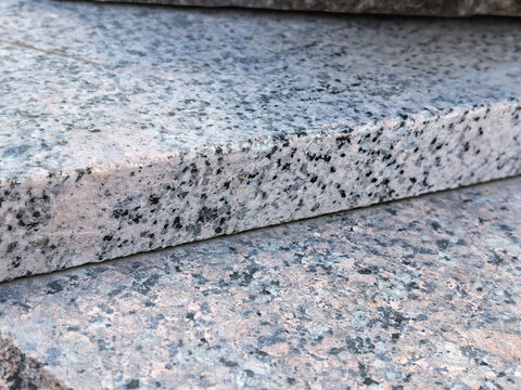 Pink granite stone slab closeup speckled texture natural building material