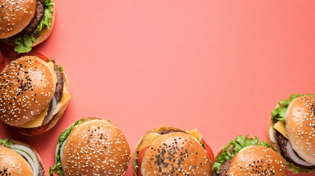 A vibrant composition of burgers forming a loose border on a pastel coral background leaving the center clear