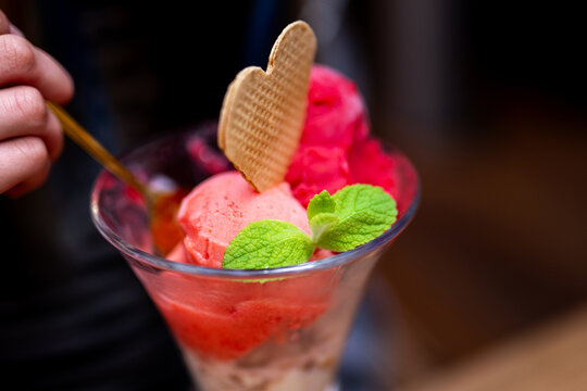 Pink ice cream sundae with heart wafer cookie