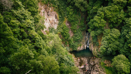 Green forest surrounds salto do cabrito waterfall and river © Alberto