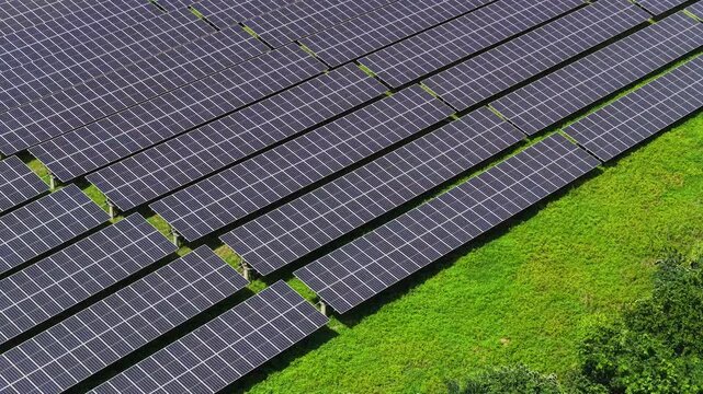 Top down aerial view of dense photovoltaic solar panels