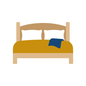 Bed with yellow sheets and pillows.