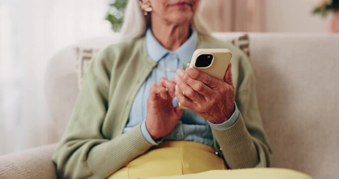 Phone, hands and senior woman on sofa in home for texting, notification or social media. Typing, relax and elderly person with cellphone for reading blog, update or email on mobile app in living room