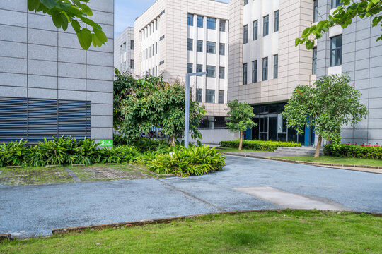 Stock imagery featuring the exterior of an office building and the environment of an industrial park.
