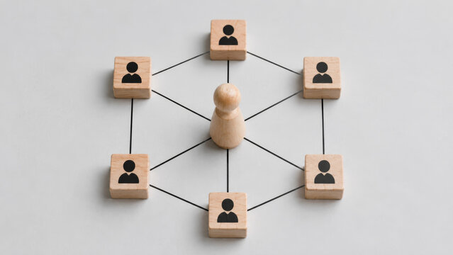 Strategy team roles project management teamwork and strategy are visually represented by wooden blocks connected in network symbolizing collaboration and effective team roles in project management