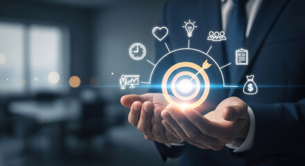 Fototapeta premium Close up of person hands holding glowing target icon with business marketing strategy symbols illustrating goal achievement and objective focus.