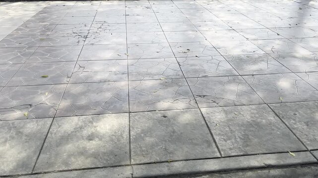 Grey ceramic tiles pavement pattern on public city square