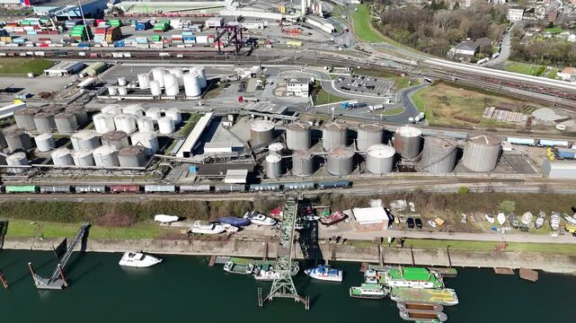 Downward drone view of tanks pipelines and tanker berth