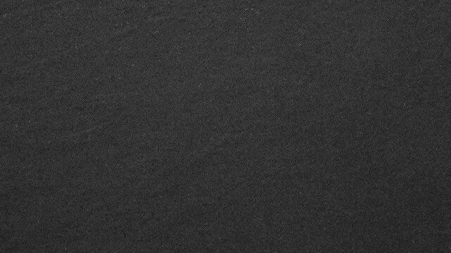 Texture of velvet black paper. Surface of black rough paper, slowly rotating.
Abstract stop-motion video of dark black felt or wool fabric texture. Scratches and dust dark grunge paper background.