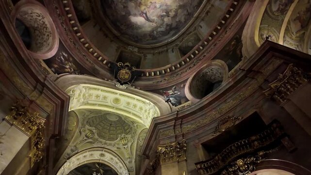 Ornate Baroque Interior of Peterskirche St. Peter's Catholic Church in Vienna, Austria - Looking Up at Gilded Vaults and Sculptures