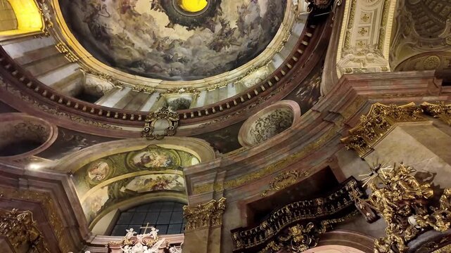 Ornate Baroque Interior of Peterskirche St. Peter's Catholic Church in Vienna, Austria - Looking Up at Gilded Vaults and Sculptures