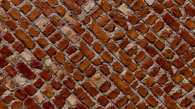 Rustic red brick wall texture with diagonal pattern, vintage architectural background