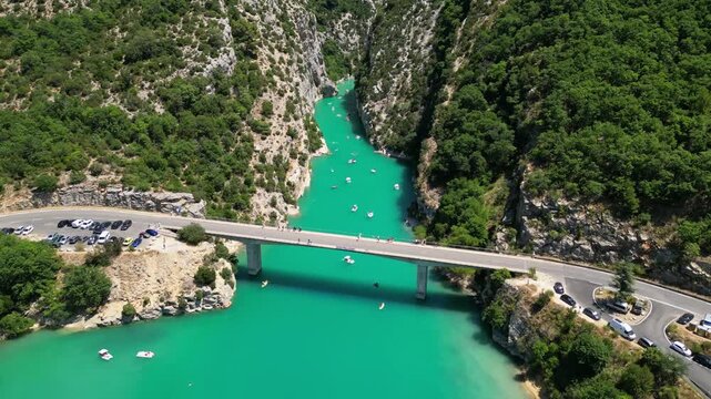 Aerial top-down drone view of the Galetas Bridge spanning the turquoise Verdon River in Gorges du Verdon, Provence, France