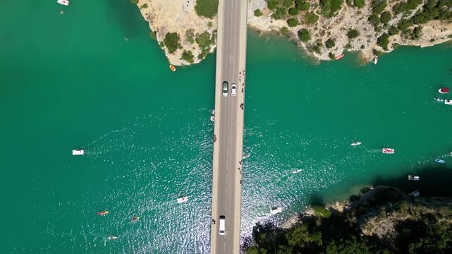 Aerial top-down drone view of the Galetas Bridge spanning the turquoise Verdon River in Gorges du Verdon, Provence, France