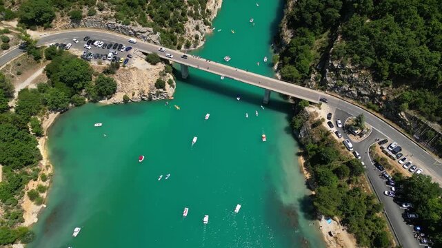 Aerial top-down drone view of the Galetas Bridge spanning the turquoise Verdon River in Gorges du Verdon, Provence, France