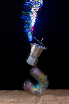 coffee maker balanced on a vase with neon light like smoke