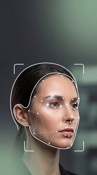 A focused woman profile mapping features with white 3d geometric wireframe mesh during biometric AI face scan procedure, charcoal and sage theme