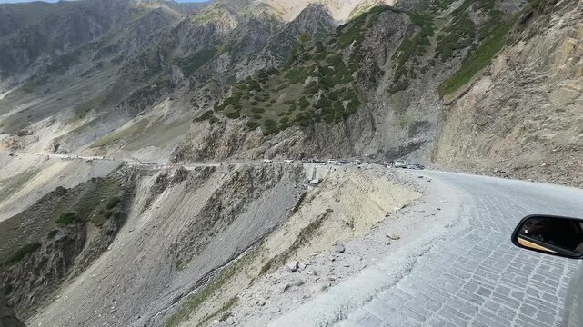 Ladakh Leh Kargil Srinagar National Highway. Travel on car on road of Ladakh Himalaya mountains. Roadtrip landscape. leisure driving under a high, rocky mountain road. landslide prone area. 
