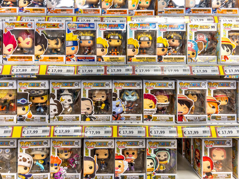 Italy - July 10, 2026: retail store shelf display packed with a collection of collectible Funko Pop vinyl figures from popular anime series including One Piece, Naruto Shippuden, and Dragon Ball Z