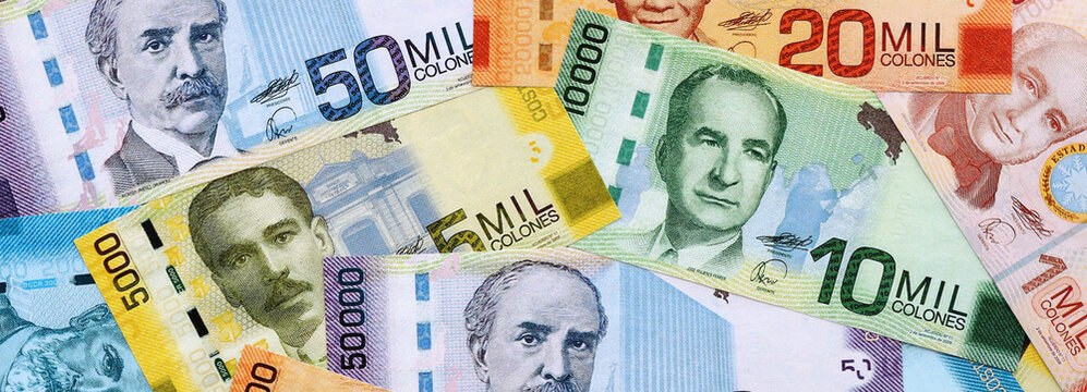 Costa Rican old colon money banknotes pile on table. Costa Rica bills of CRC currency close up