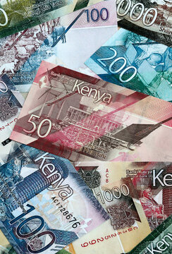 Kenyan shilling money banknotes pile on table. Kenya bills of KES currency. Concept of economy