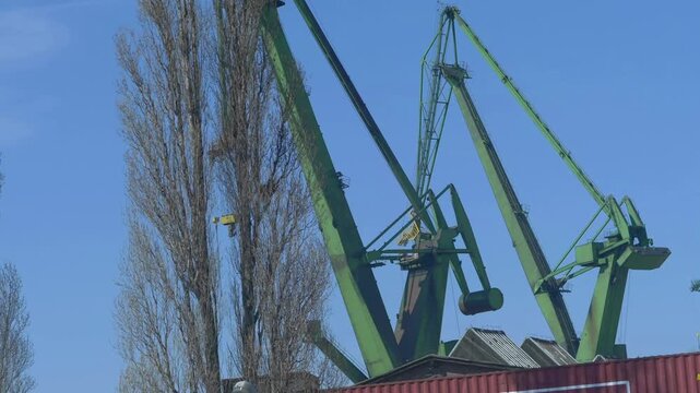 Industrial port with cranes and ships in Gdansk, Poland in 4k slow motion 60fps