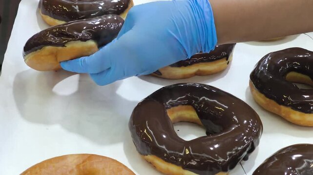 Classic ring donuts coated with a thick and glossy chocolate glaze