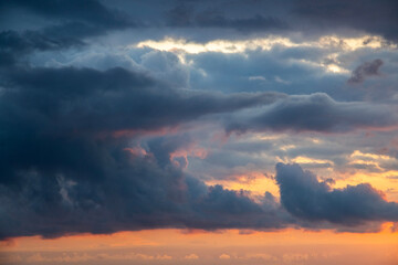Fototapeta premium Sunset after rain with thunder clouds. Sky background.