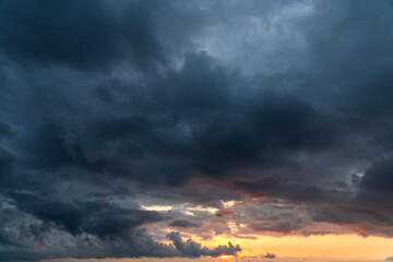 Fototapeta premium Sunset after rain with thunder clouds. Sky background.