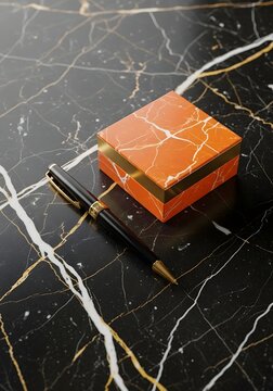 Elegant pen and gift box on black marble background luxury stationery composition