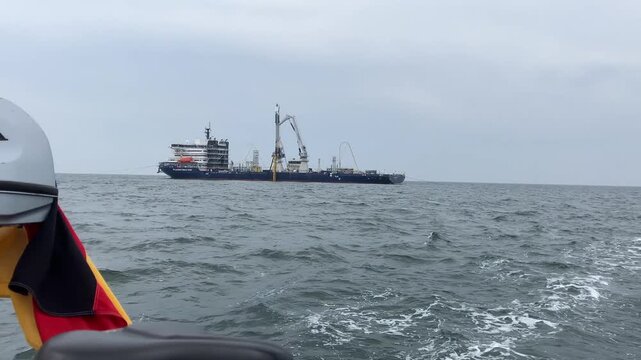 Boat Saddle Detail With Cable Ship Behind