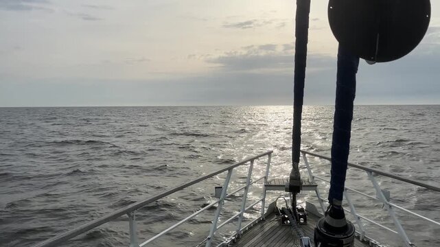 Sunset Foredeck Shot With Rotating Anchor Emblem