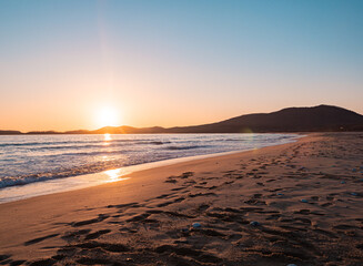 Obraz premium Sunset on the beach. Orange and golden sunset sky calmness tranquil relaxing sunlight summer mood.